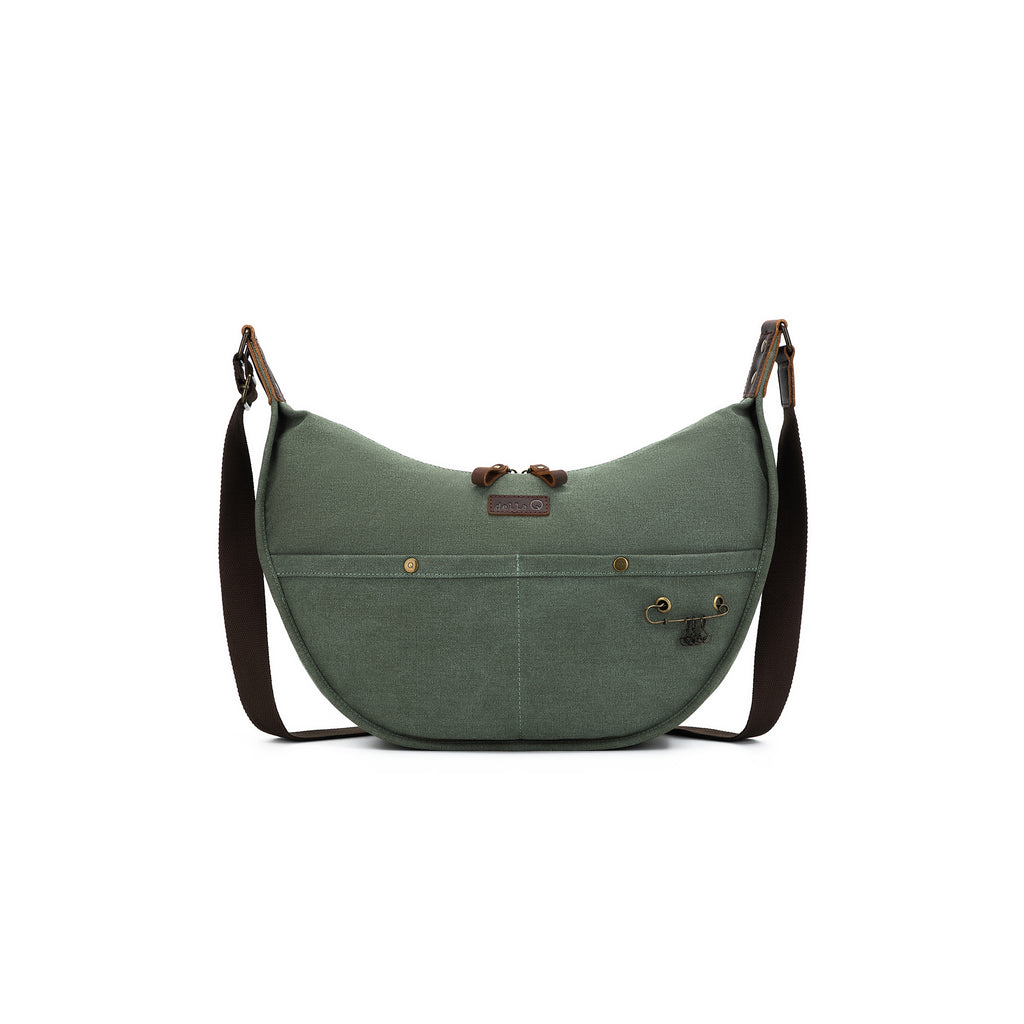 Earthy green olive bag with signature della Q shape and features. Includes brown adjustable strap, exterior storage, and yarn-access grommet.